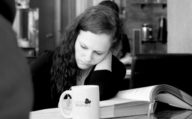 Random customer studying while enjoying a tea at the Green Beanery.